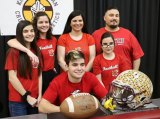 Julien Pierce, a Kings Christian standout football player signed to play for Arizona Christian University. With him is his family (l to R) sisters Alexa, Kylie, Aleya and mom Sarah and dad Justin.